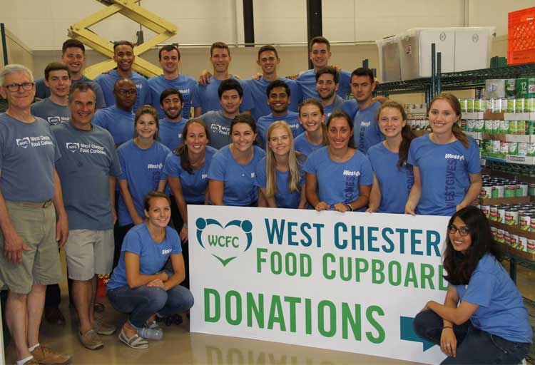 Ambassador Interns participate in a Volunteer Day at the West Chester Food Cupboard.