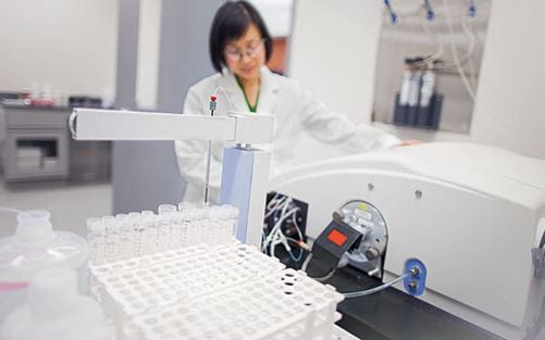 A scientist performing tests in a laboratory