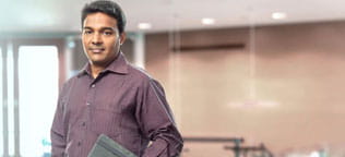 Team member holding notebook 
