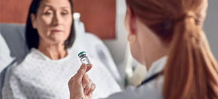 Patient receiving medication from doctor