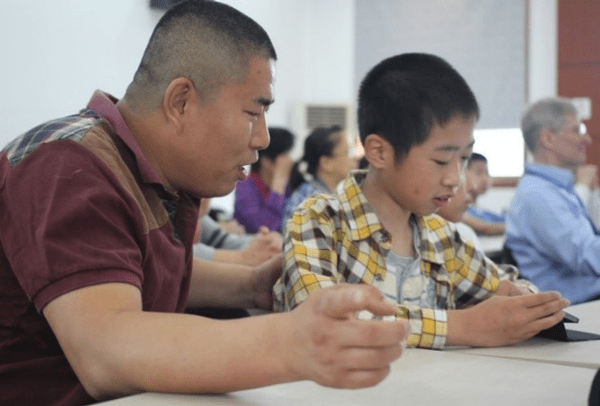 Binghuan volunteering at the Qingpu Special Children's school