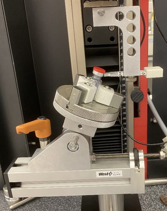 Custom-designed apparatus for measuring Flip-Off Seal cap removal force.