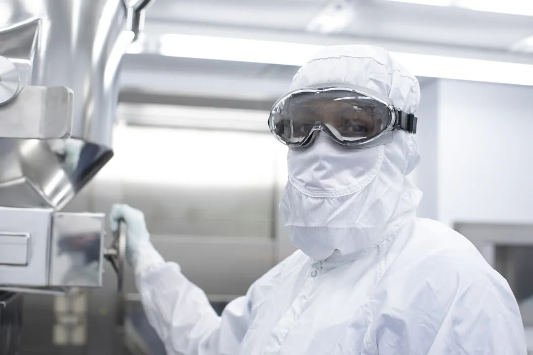West scientist working in a sterile cleanroom ensuring Annex 1 compliance in pharmaceutical manufacturing