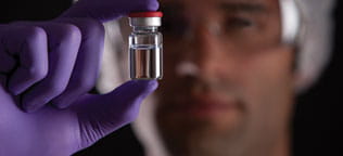 Doctor holding up vial