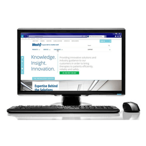 The New WestPharma Website on a computer with keyboard and mouse