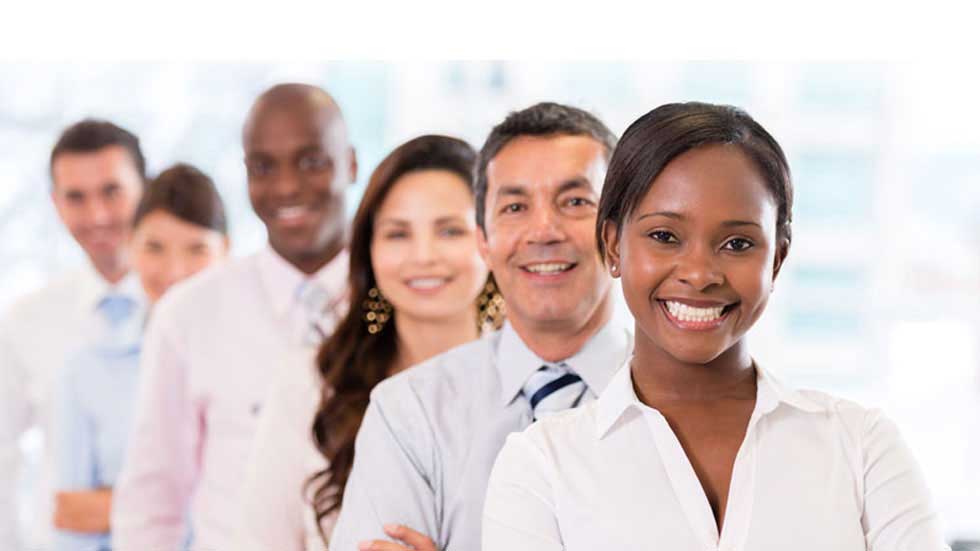 Employees in support smiling into the camera